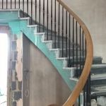 sweeping oak handrial on oval staircase